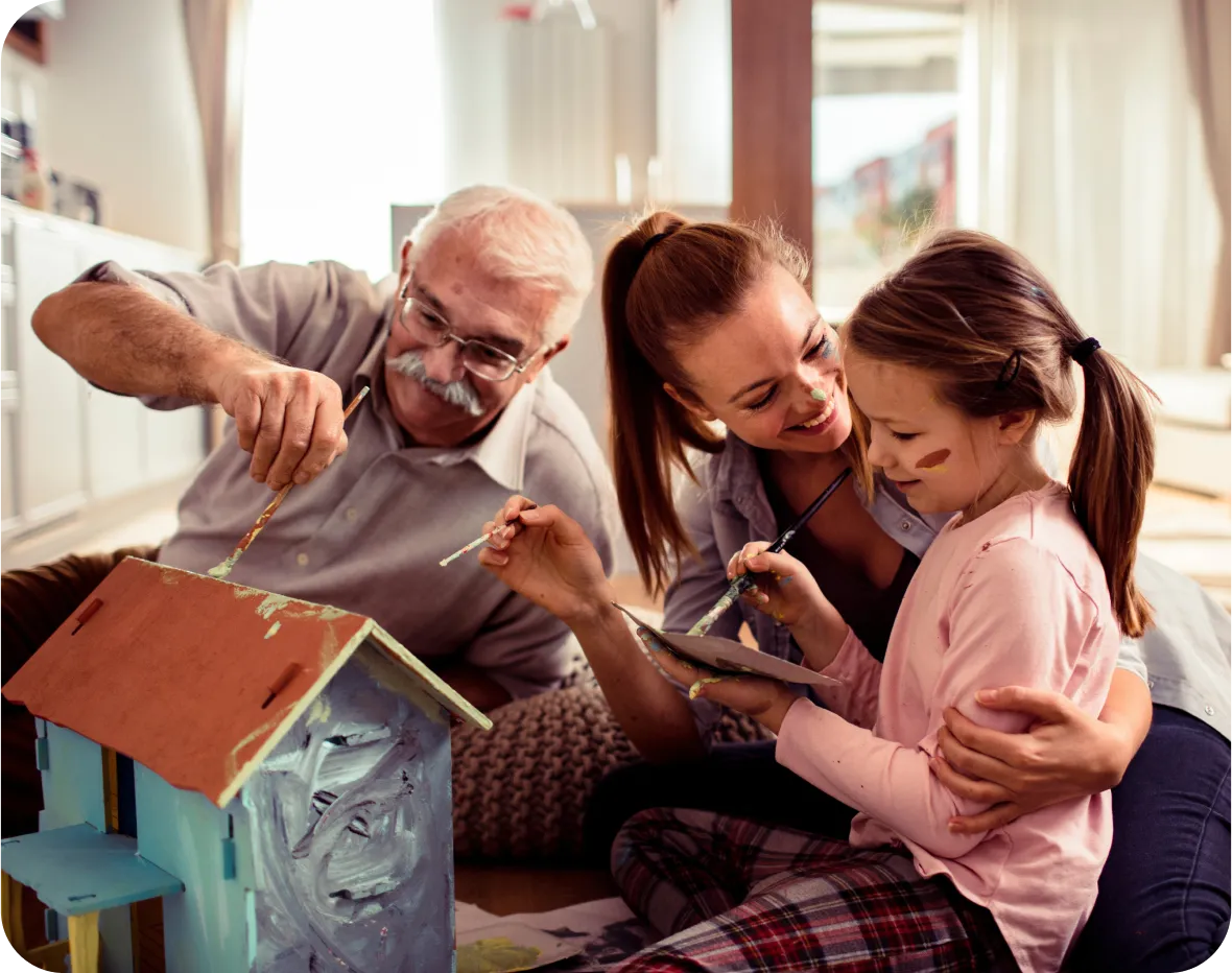 grandfather mother and daughter painting house